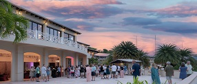 group of people at sunset enjoying an incentive travel trip