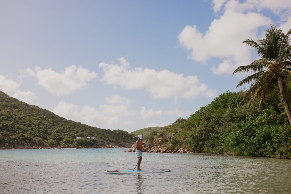 a man paddle boarding in the Caribbean