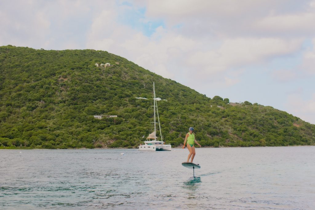a woman efoiling near Scrub Island and Marina Cay in BVI